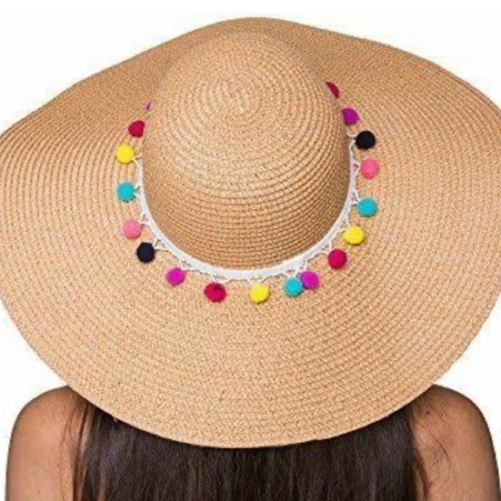 Straw sun hat. Beach hat. Colorful Pom poms